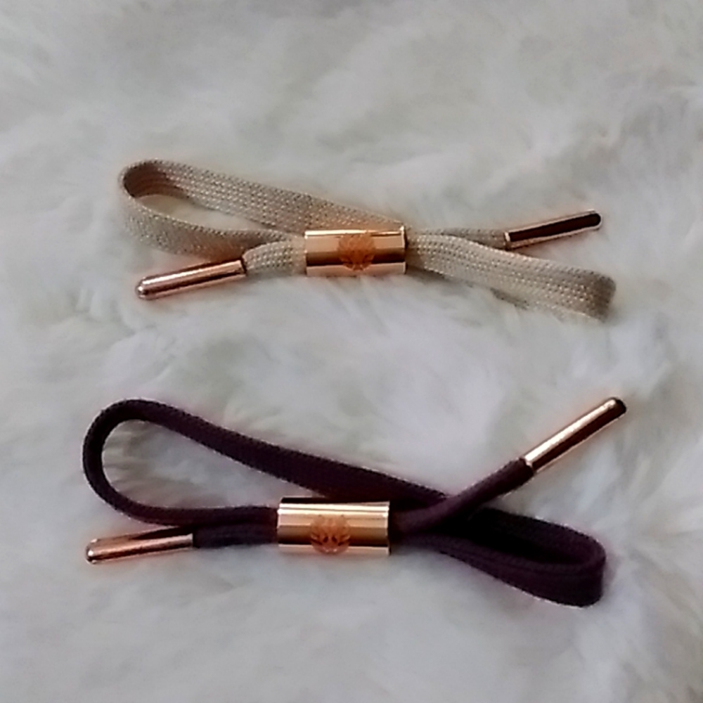2 bracelets with rose gold aglets